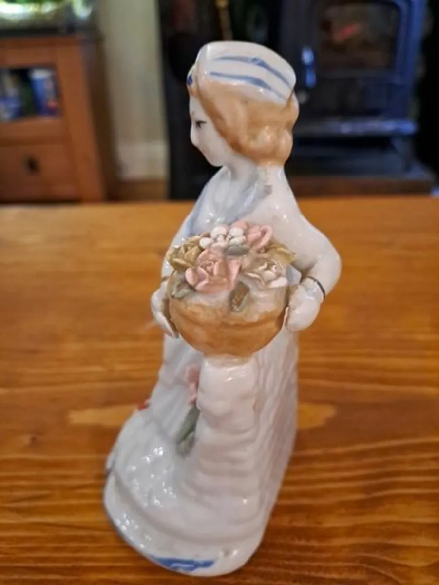 Vintage porcelain woman figurine detailed flowers - Image 3