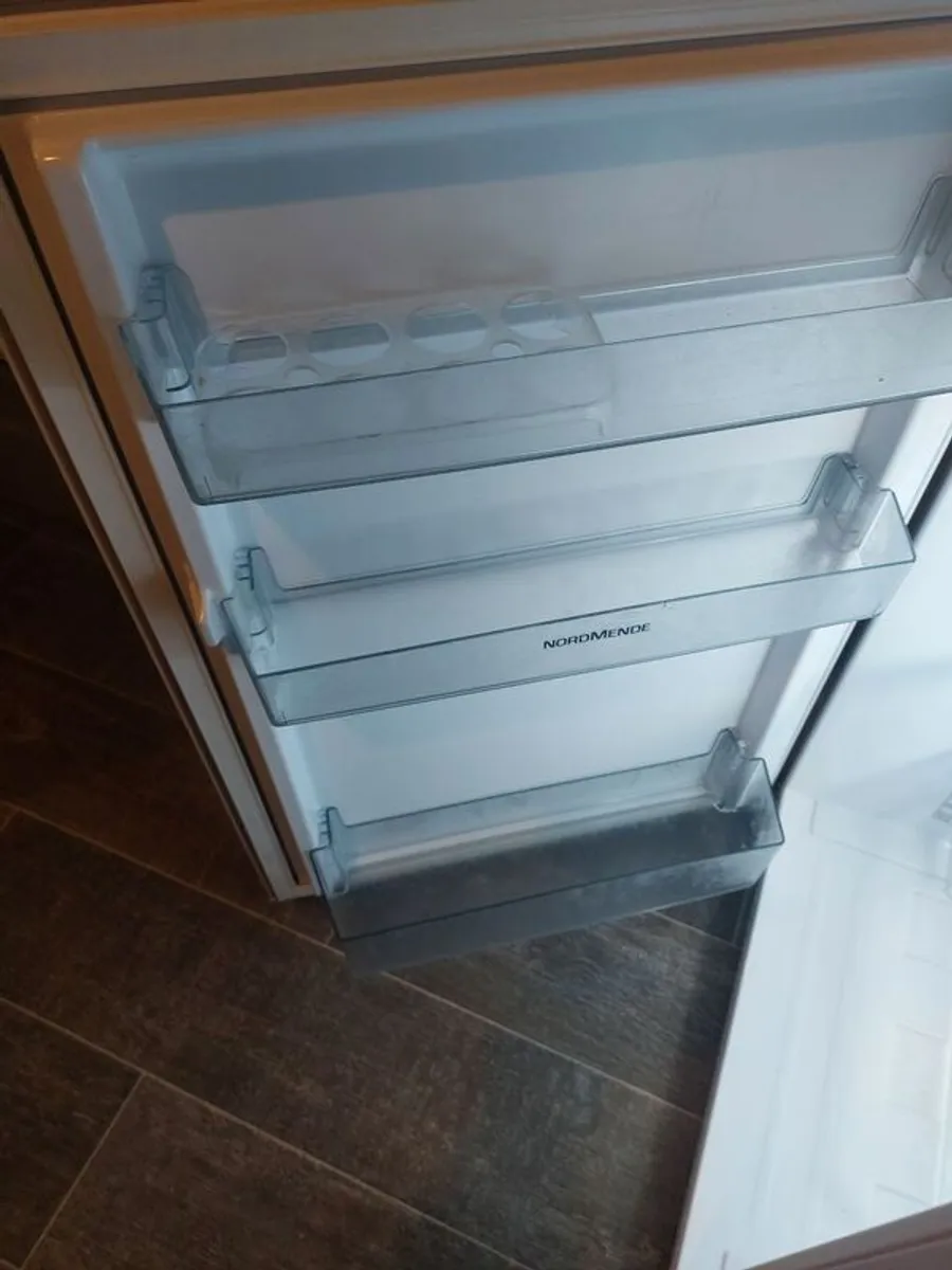 undercounter fridge freezer . And black microwave small - Image 1