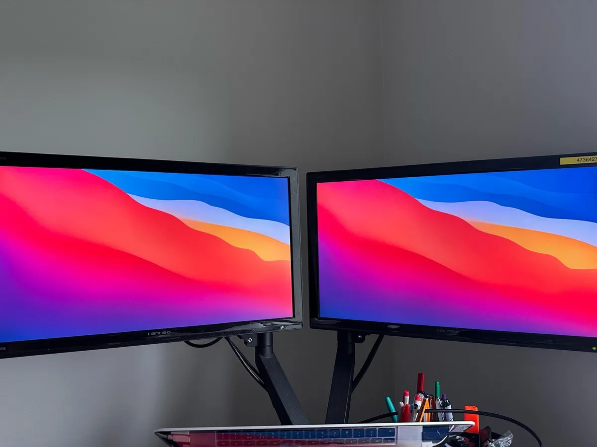 Twin monitors screens on height adjustable radial - Image 1
