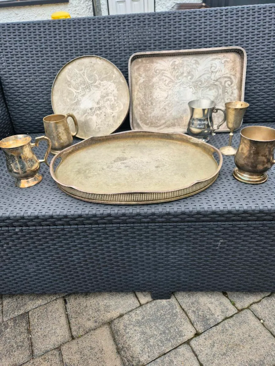 8 pieces sliver plated/ looking trays & tankards