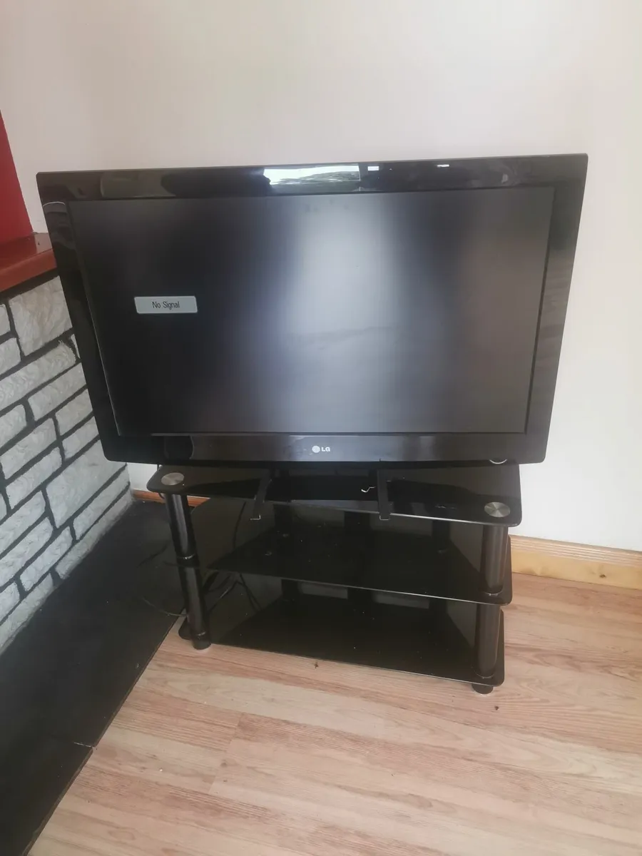 Television and stand - Image 1