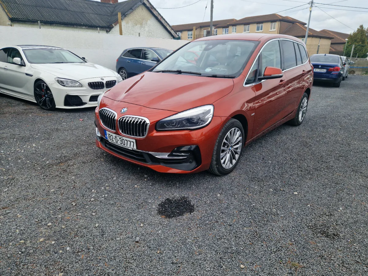 BMW 218D Gran Tourer 7 seater in Sunset Orange - Image 1