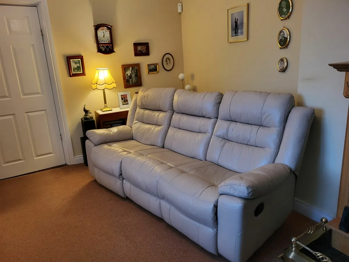 Reclining  cream leather sofa and matching chair. - Image 1