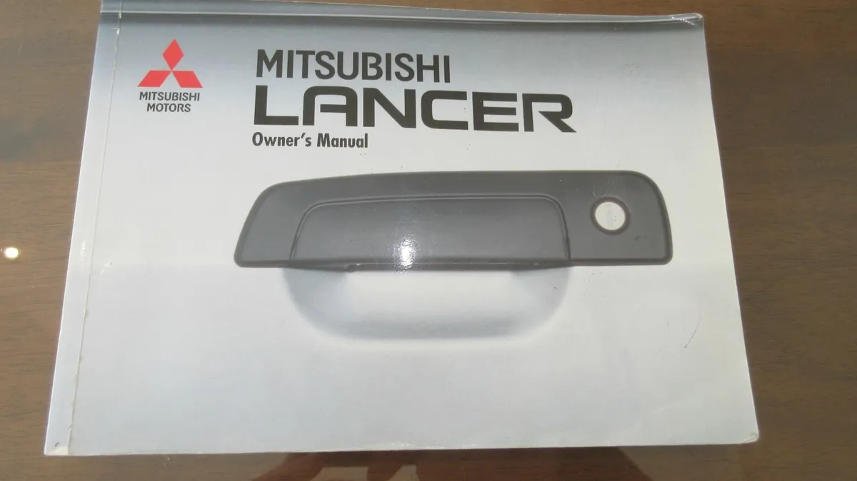 book vintage Manual Car old Mitsubishi Lancer - Image 1