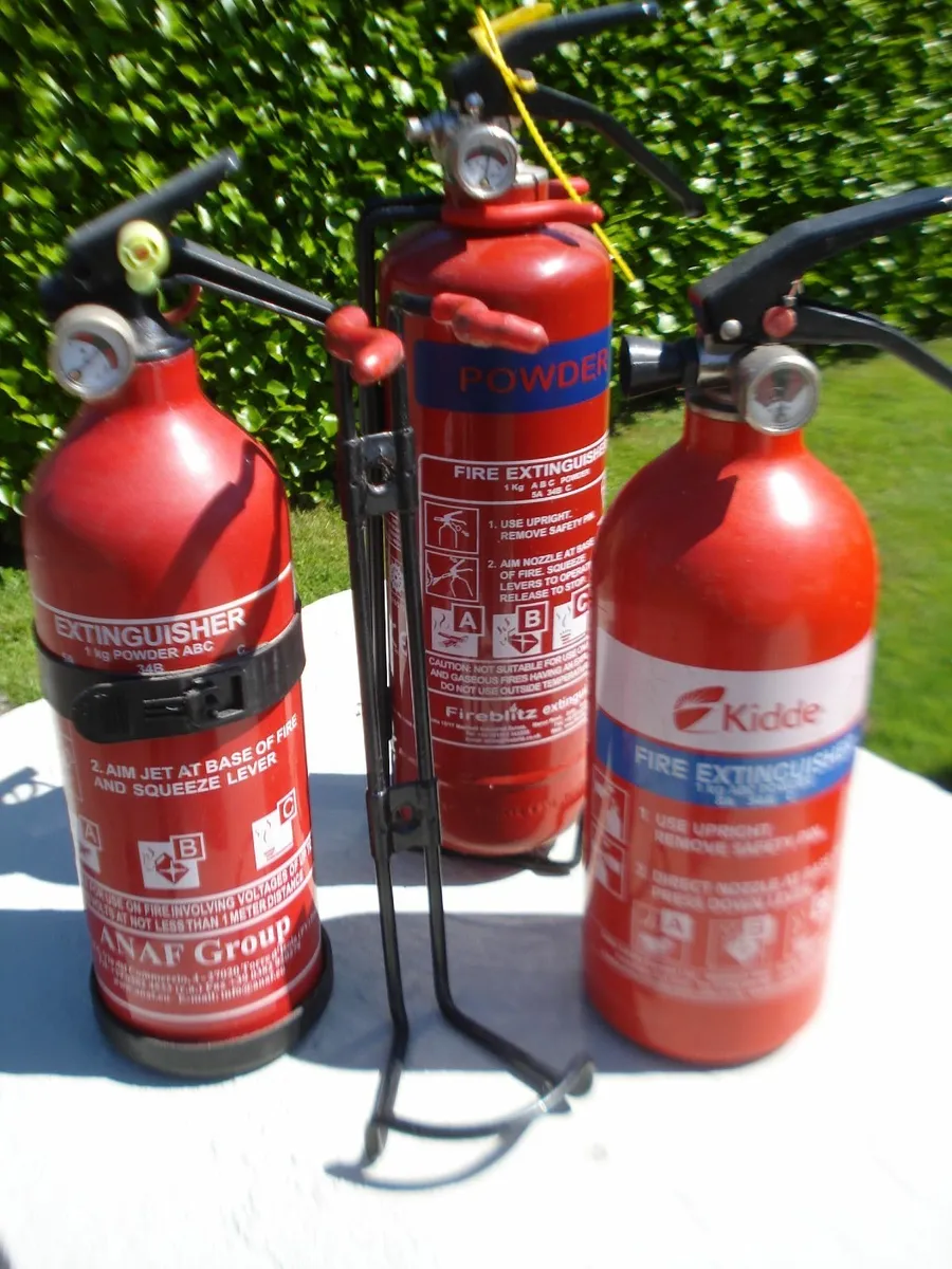3 SMALL FIRE EXTINGUISHERS WITH BRACKETS. - Image 1