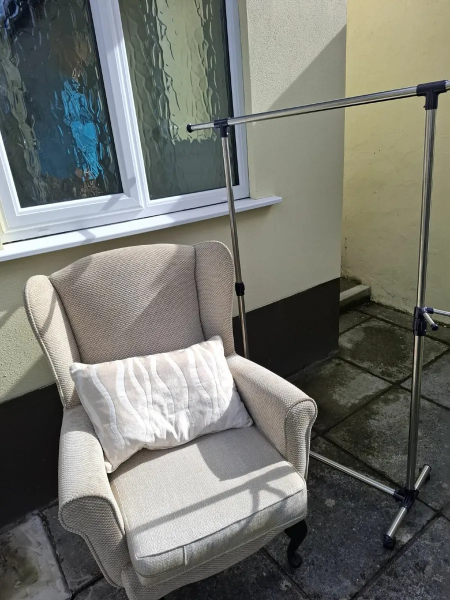 Armchair and cloths rail