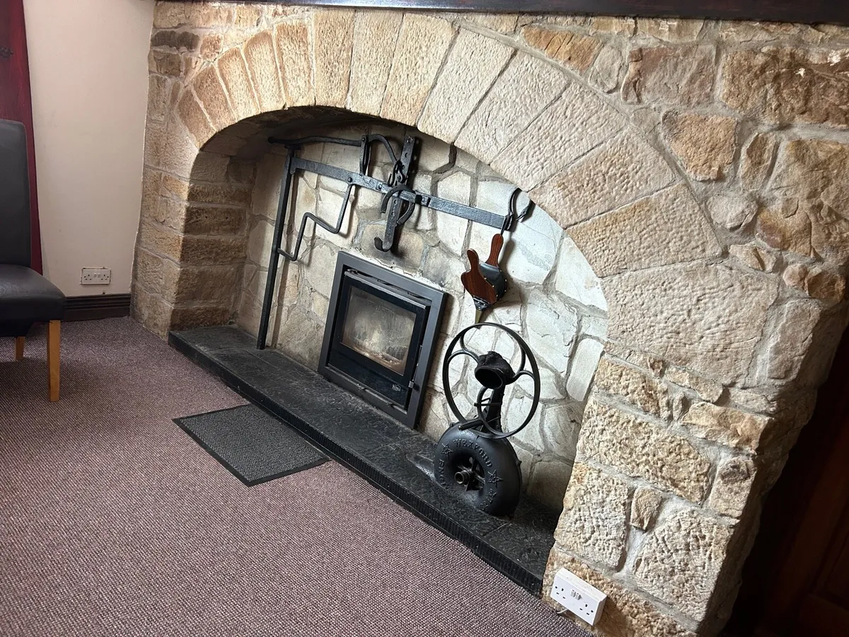 Stone fireplace and arch - Image 1