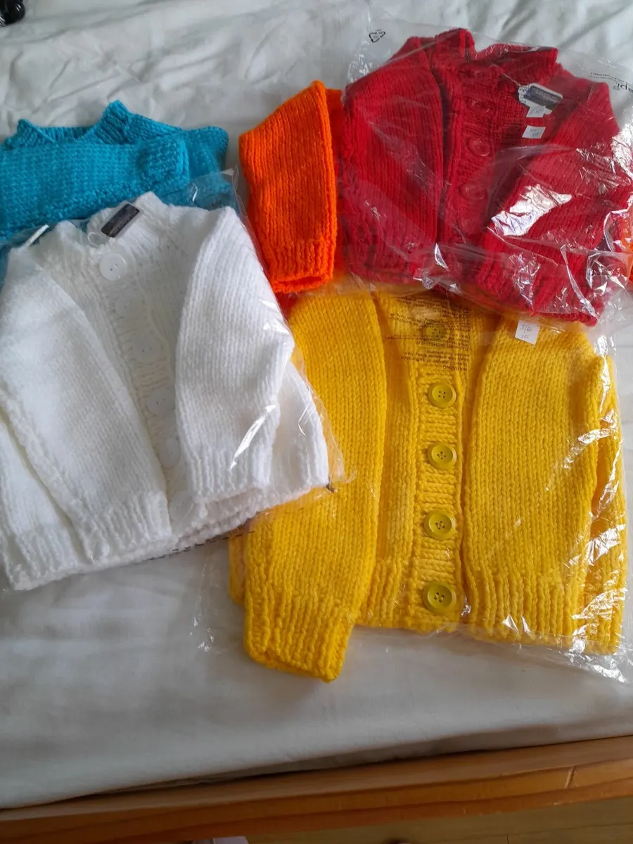 Hand knit childrens cardigans.