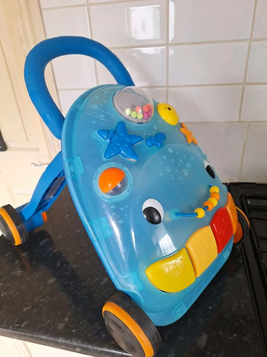 B Toys walk and play musical activity walker