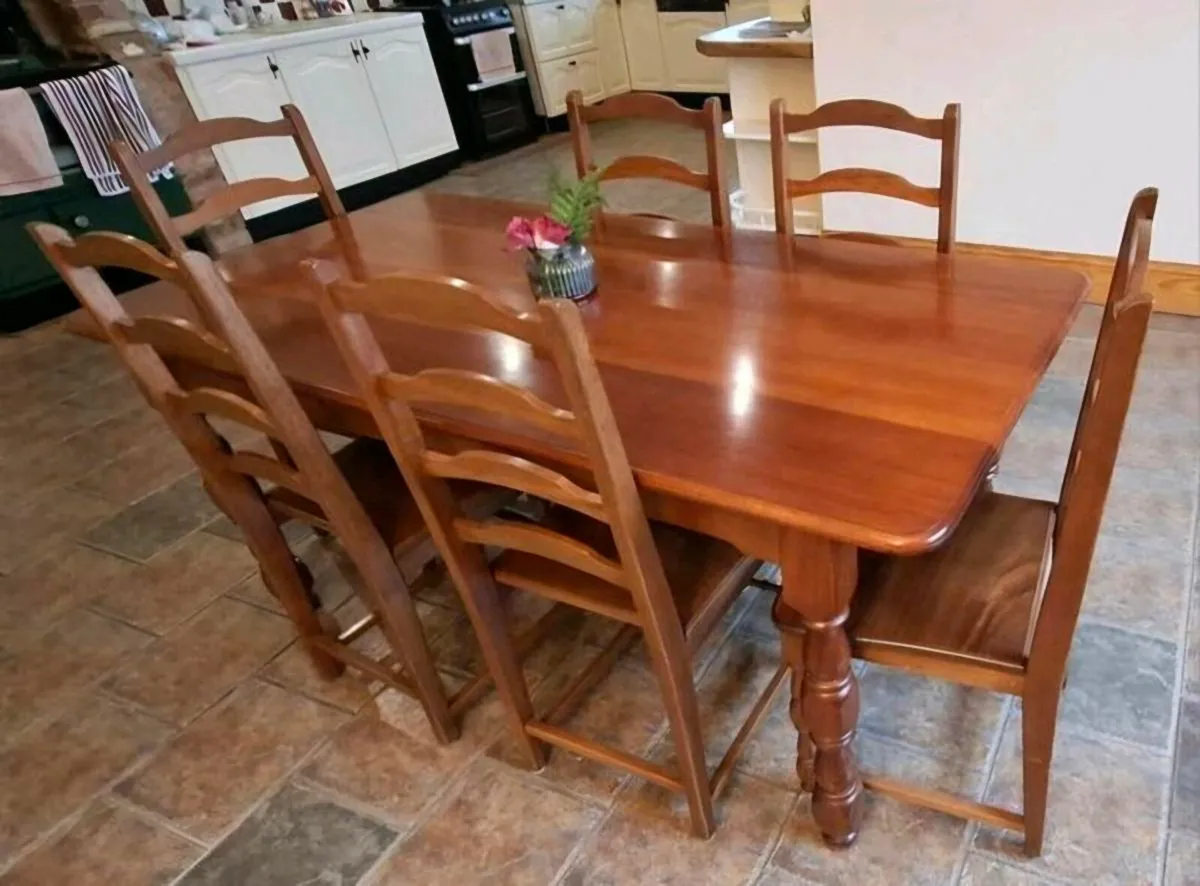 Teak dining table and chairs  x6-- 71x36 x30" - Image 1