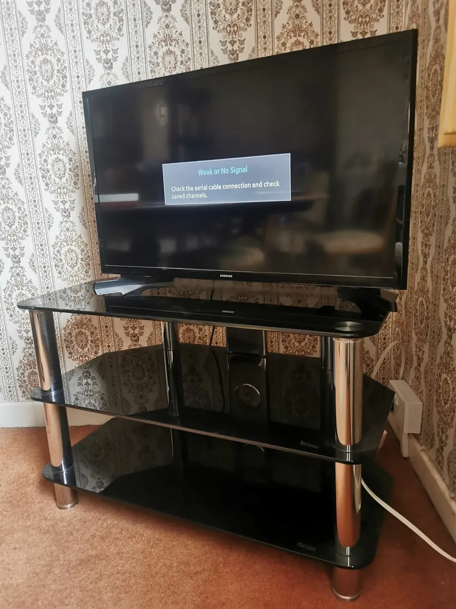 Television and Glass Table - Image 1
