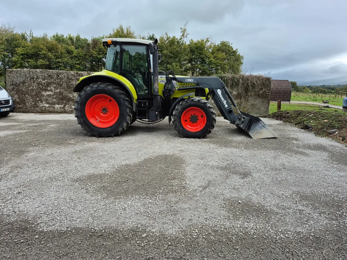 CLAAS tractor and loader - Image 1