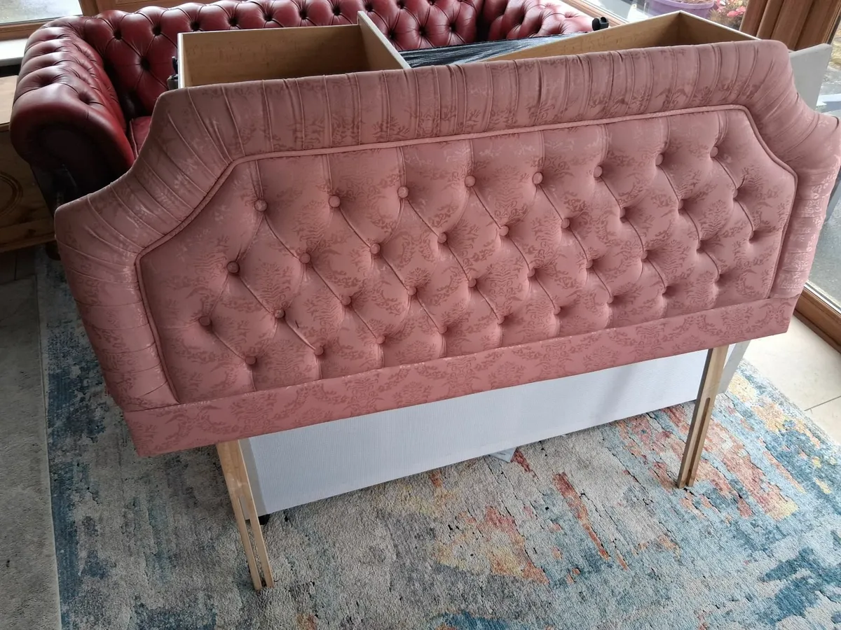 Double divan bed with pink upholstered  head board - Image 1