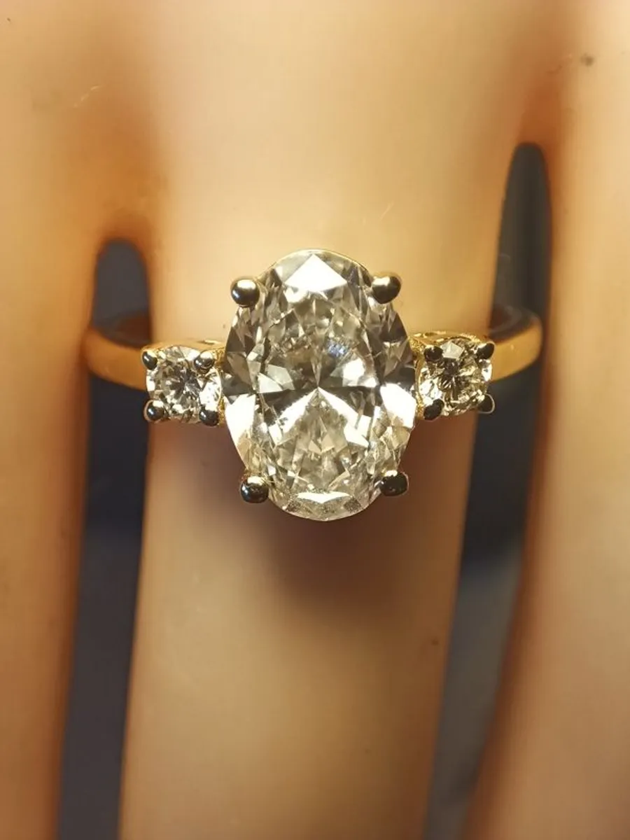 14ct Yellow Gold Oval Brilliant Diamond Solitaire Ring with Accents - Image 1