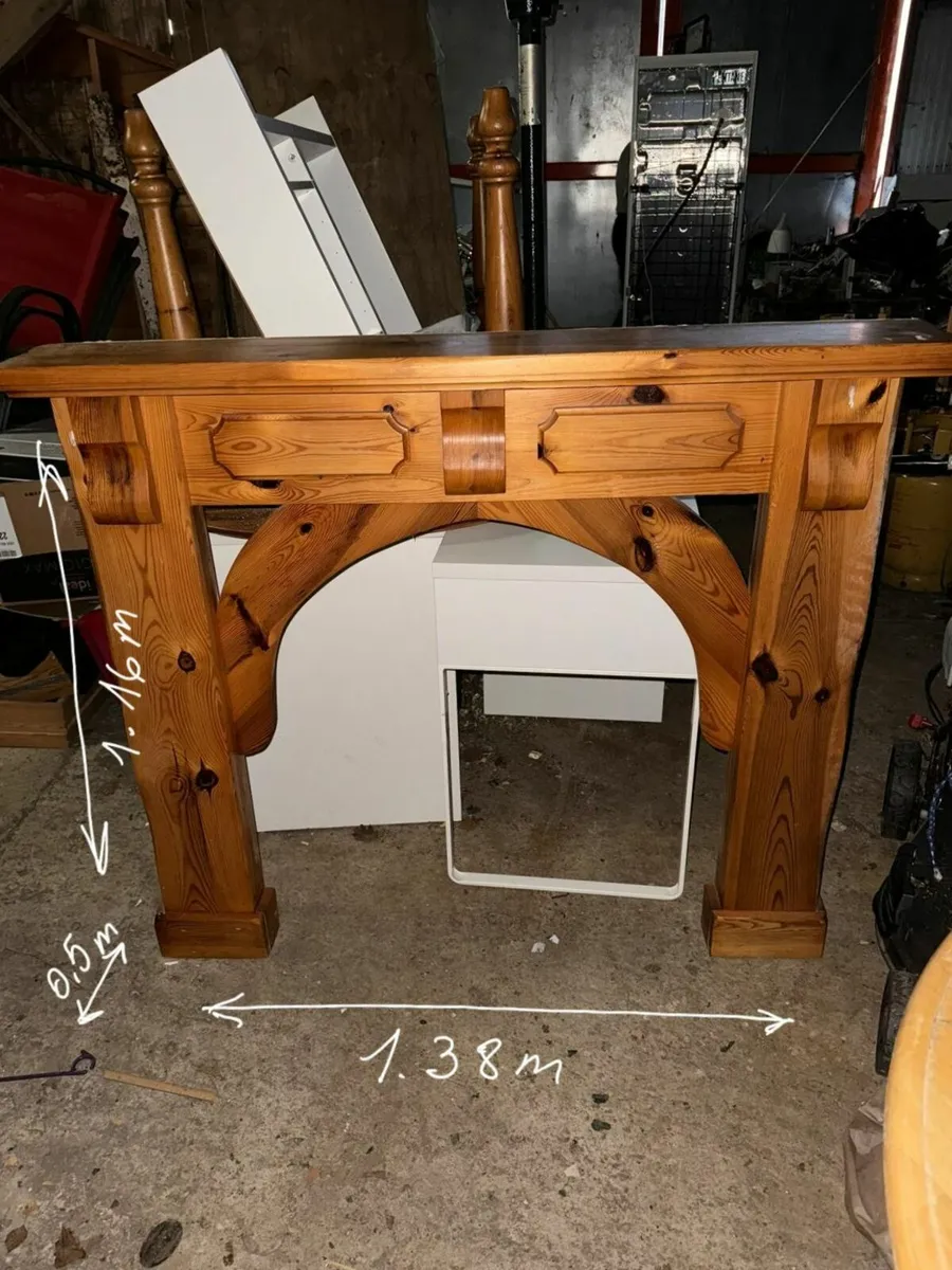 Arched wooden fireplace