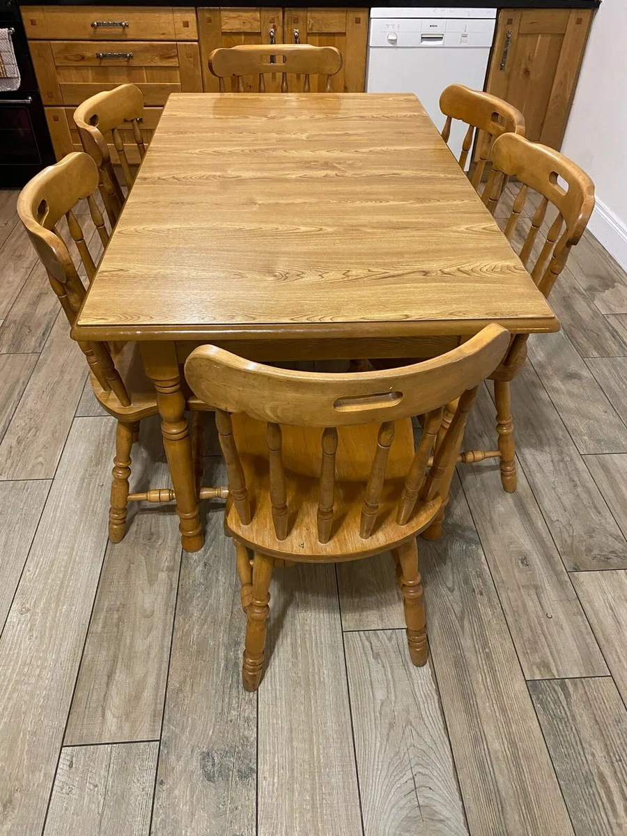 Extendable Wooden table and chairs - Image 1