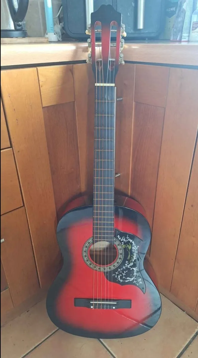 Red classical guitar with floral decor - Image 1