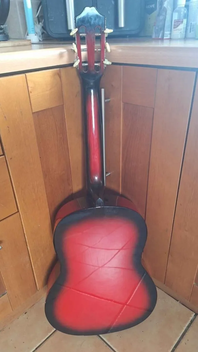 Red classical guitar with floral decor - Image 2