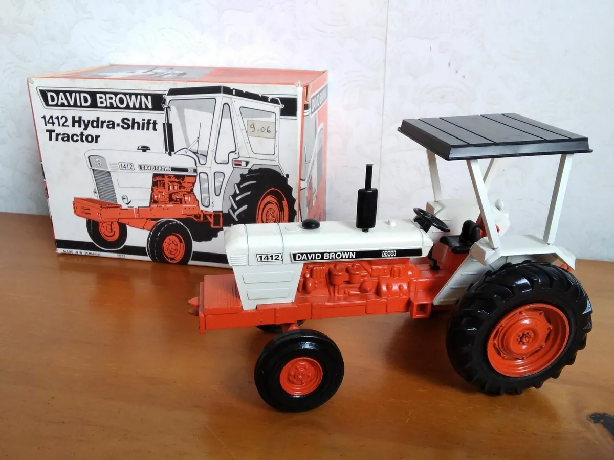 Cropmaster badge and model tractors. - Image 4