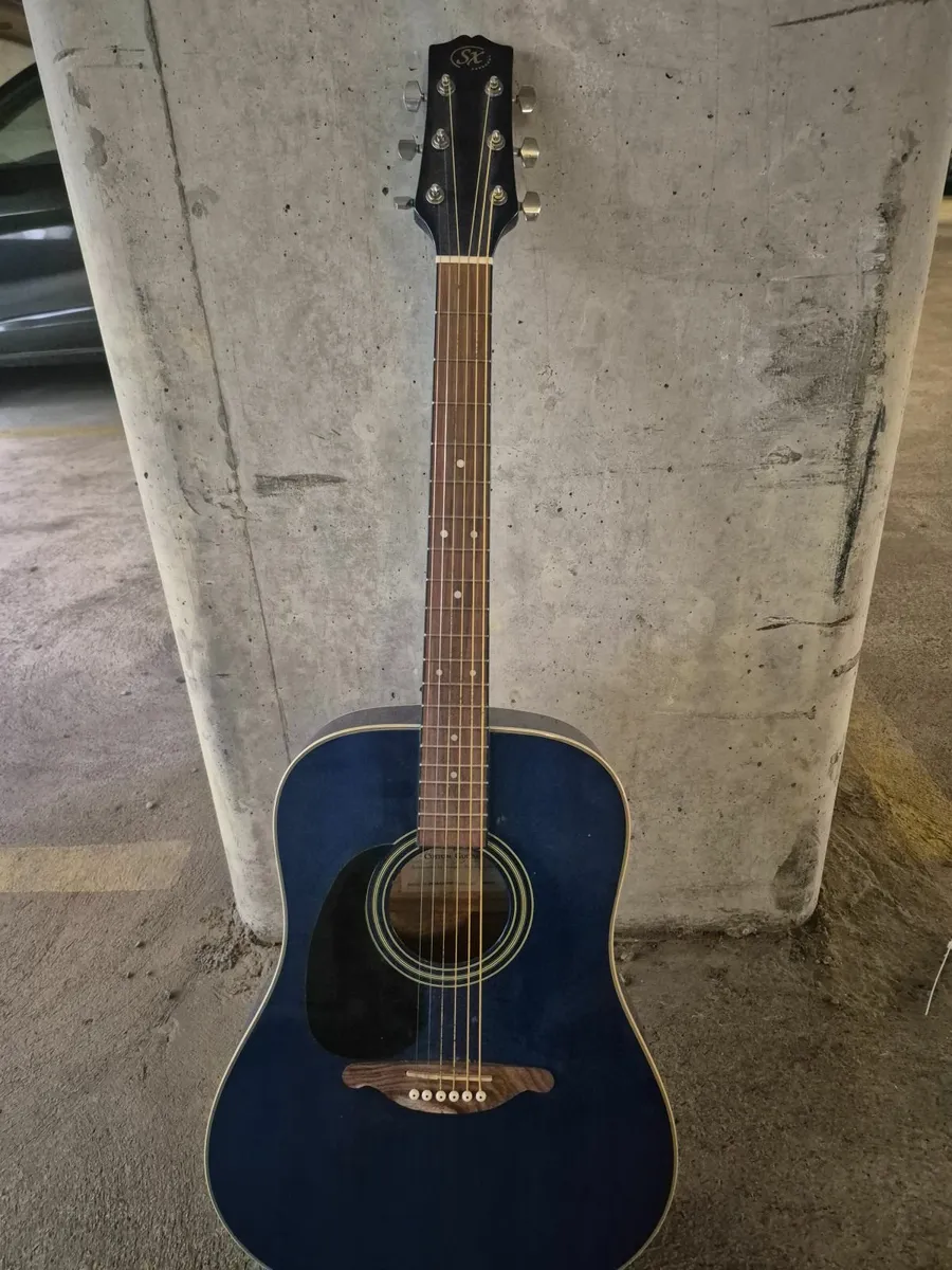 SX acoustic guitar, left handed