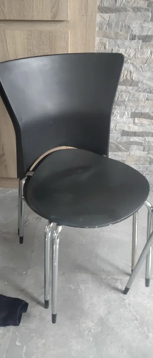 Black plastic chairs with silver legs . please rea - Image 2