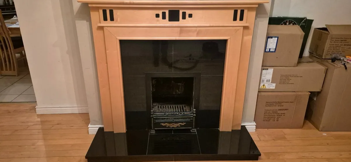 Fireplace surround and grate. - Image 2