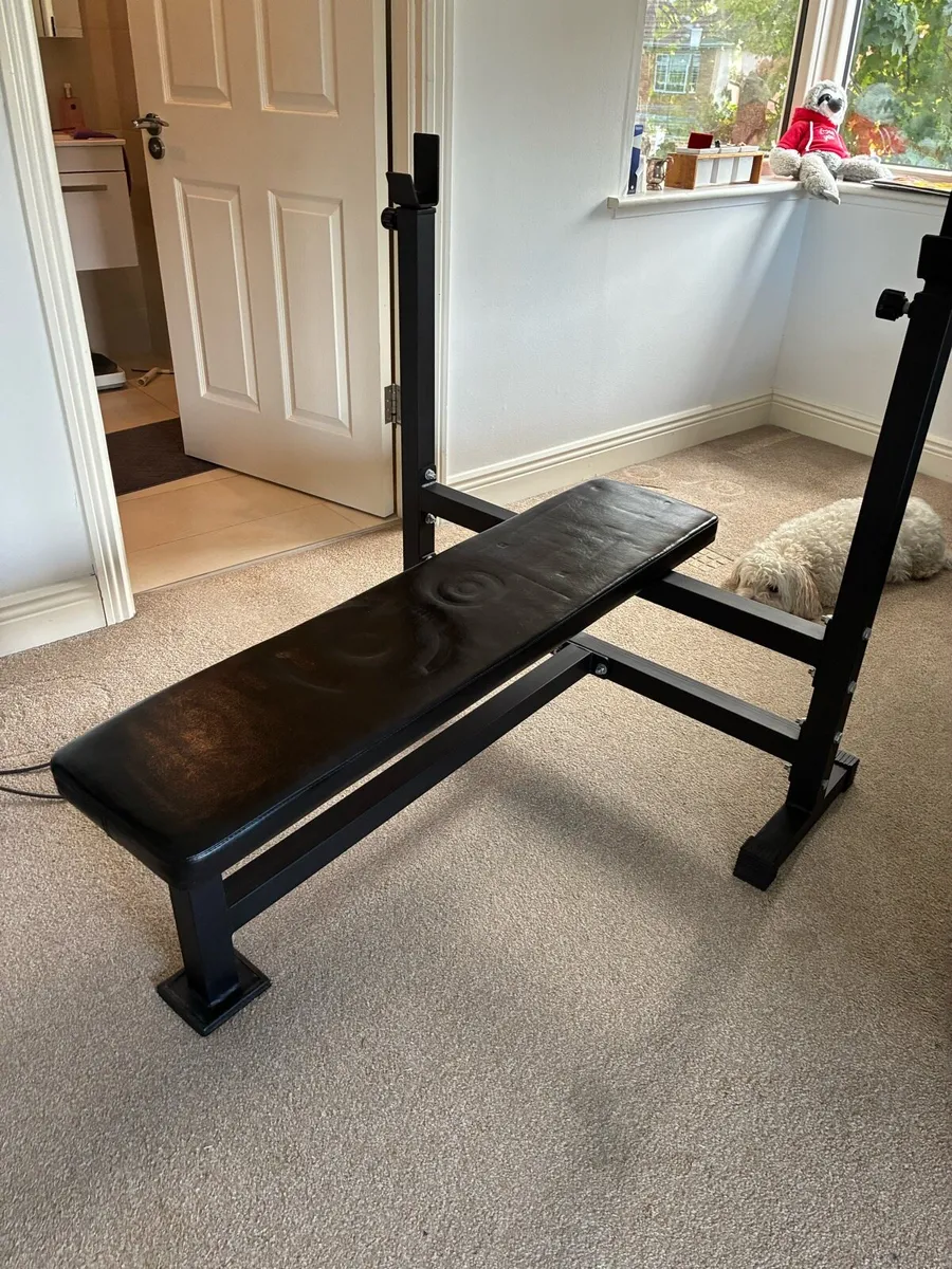 Olympic flat bench with barbell and iron plates - Image 1