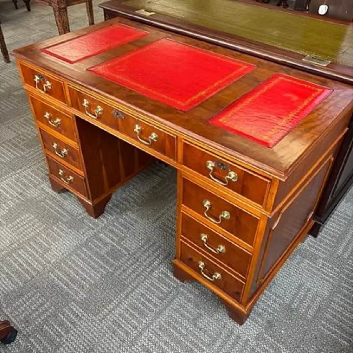 Yew red leather top twin pedestal writing desk. Ke