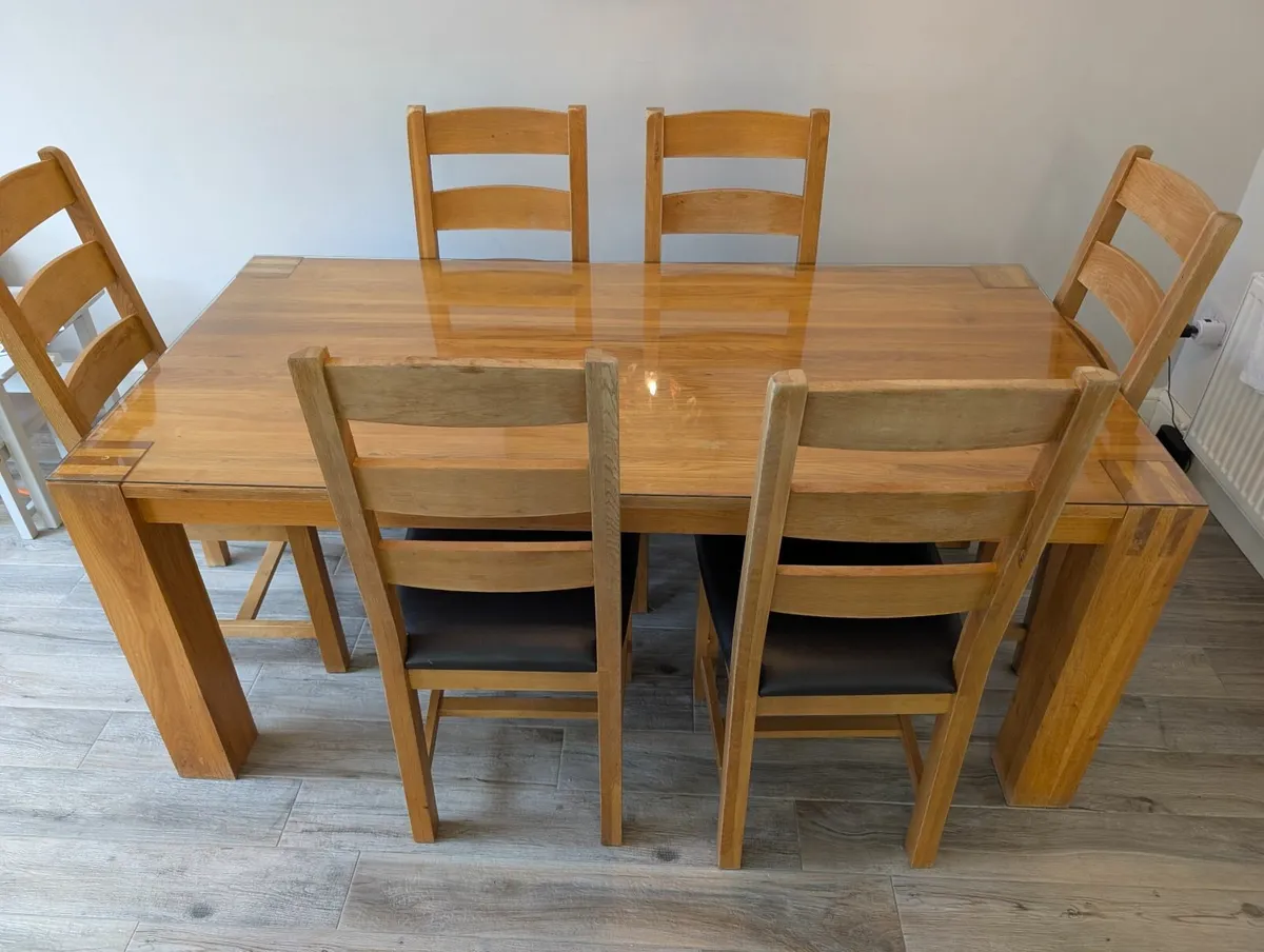 Solid Oak Dining Table (+ extensions) and chairs - Image 1