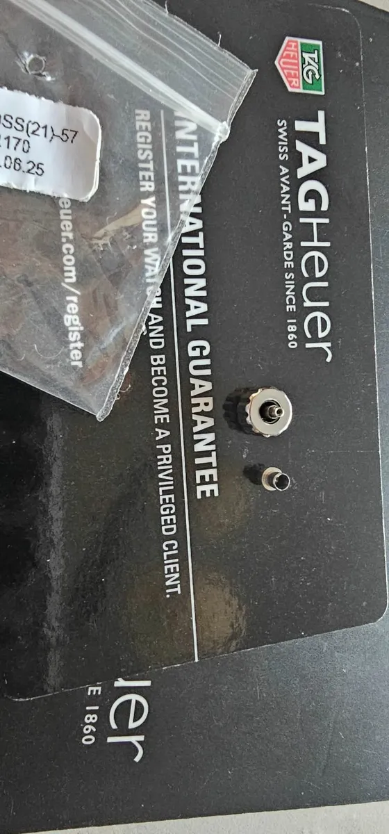 TAG Heuer original parts, warranty card, and paper - Image 2