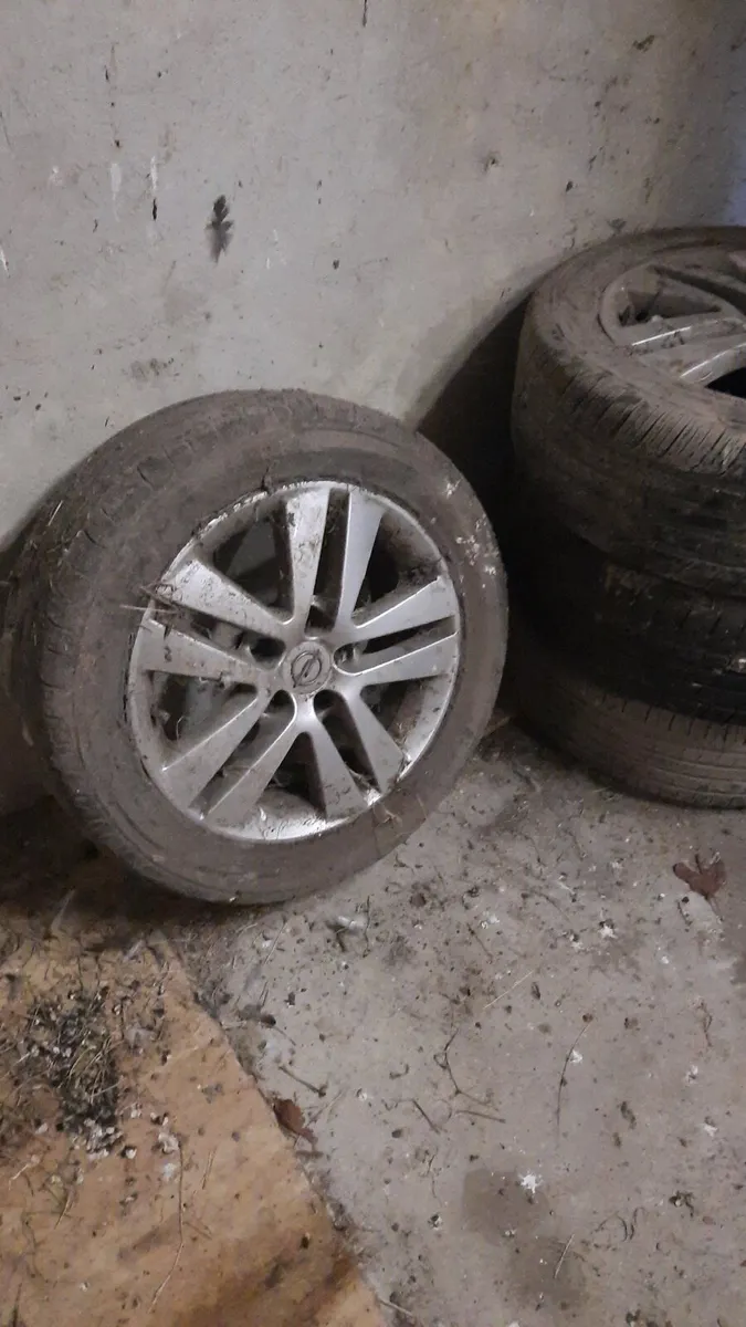 Astra Opel tyres with alloys and spare wheel - Image 1