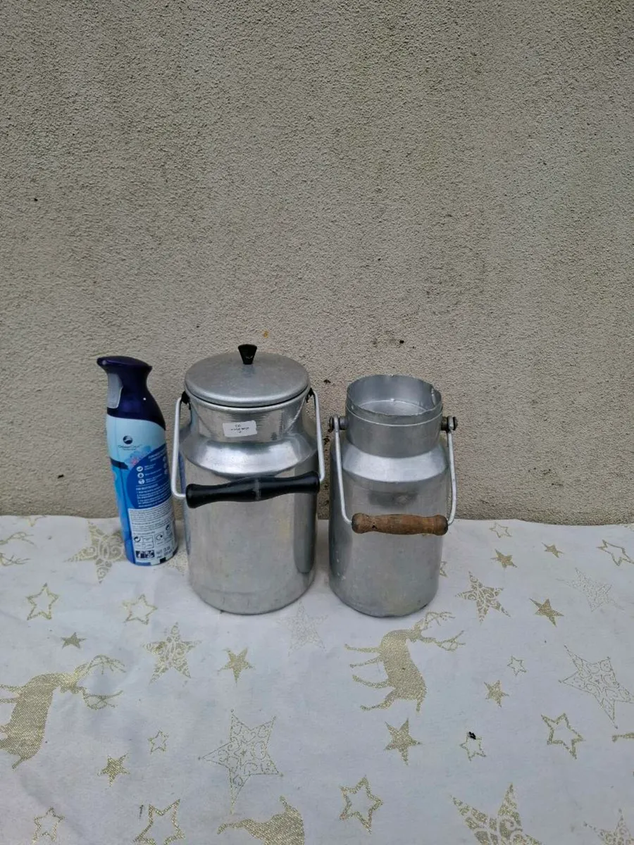 Duo vintage milk cans possible to post