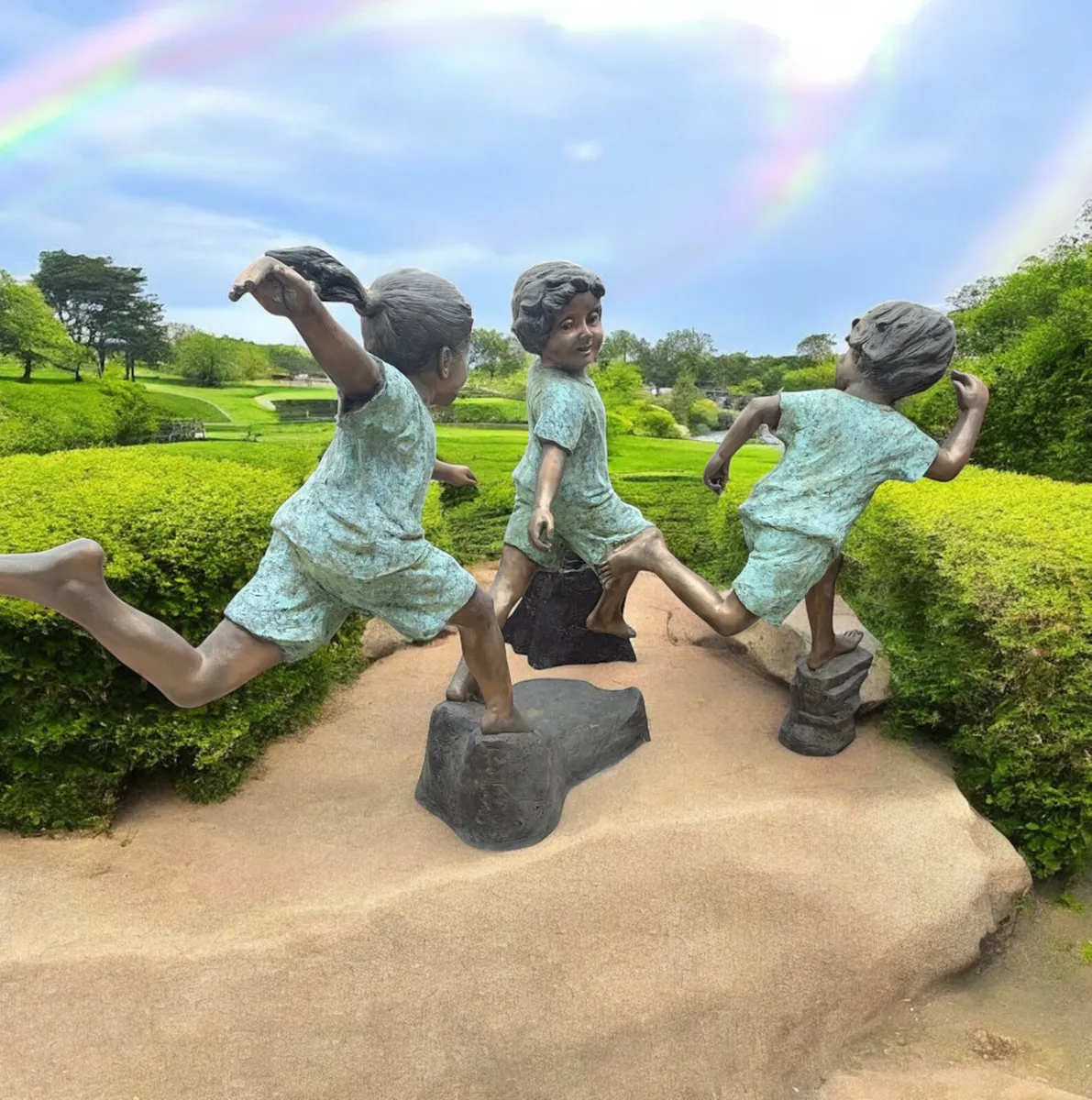 Bronze kids playing tag