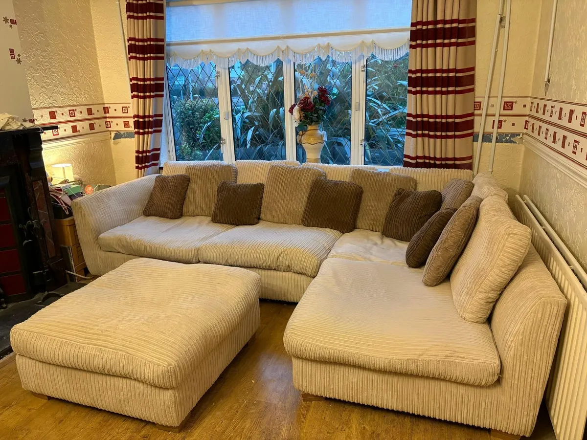 Large beige couch and ottoman with cushions - Image 1