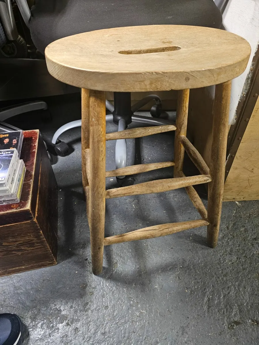 Vintage small oval top semi high stool.