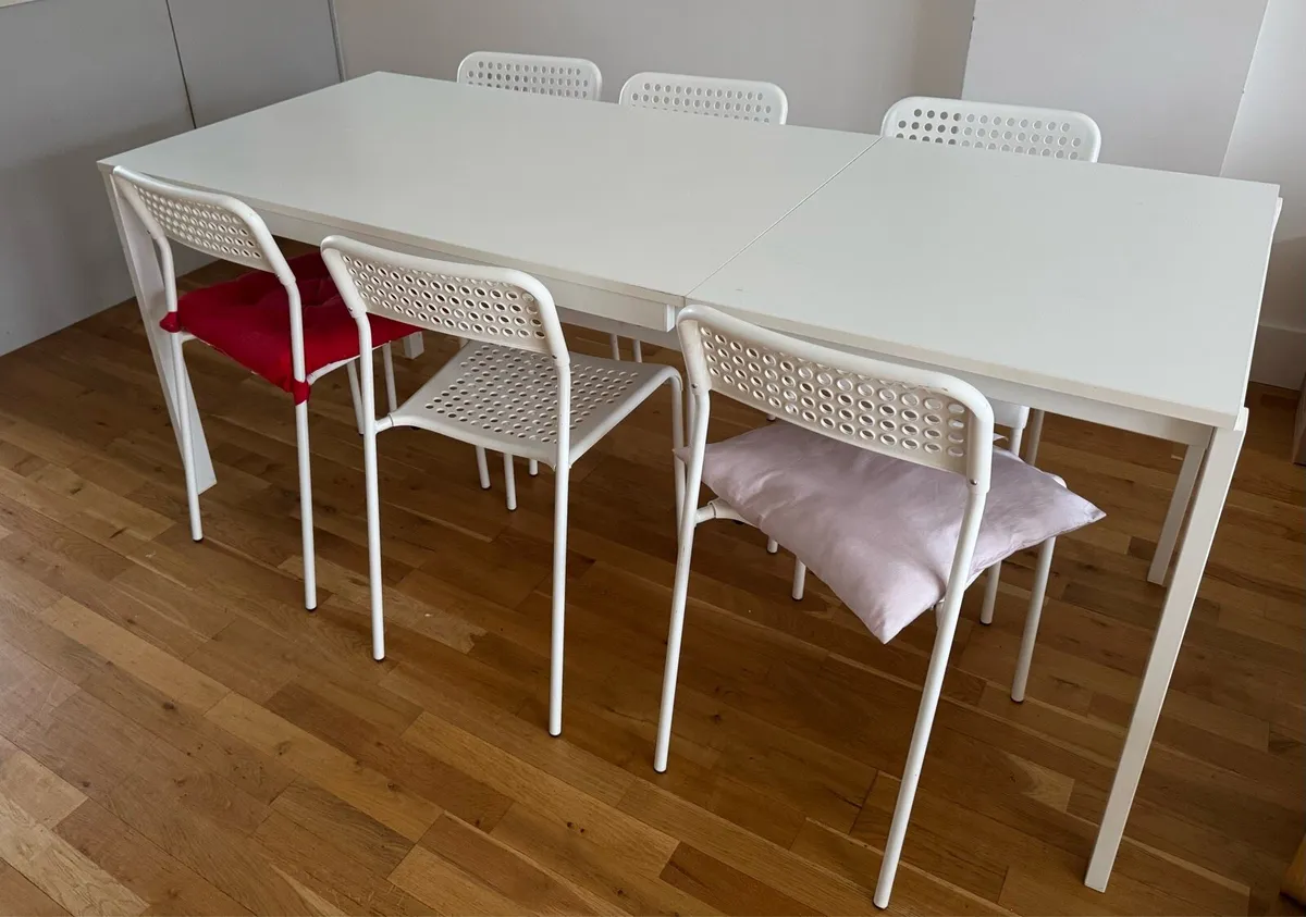 IKEA extendable table with 8 chairs - Image 1