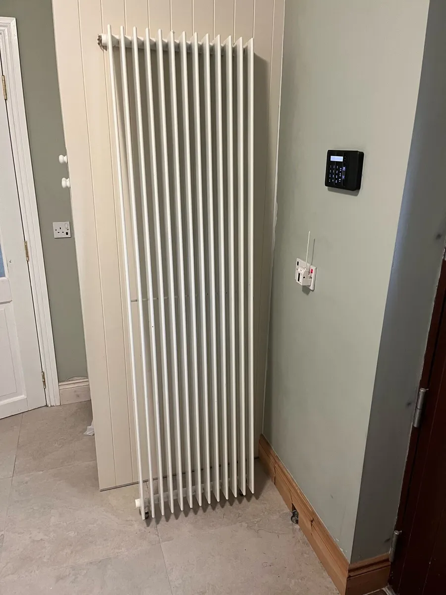 Vertical central heating radiator with brackets - Image 1