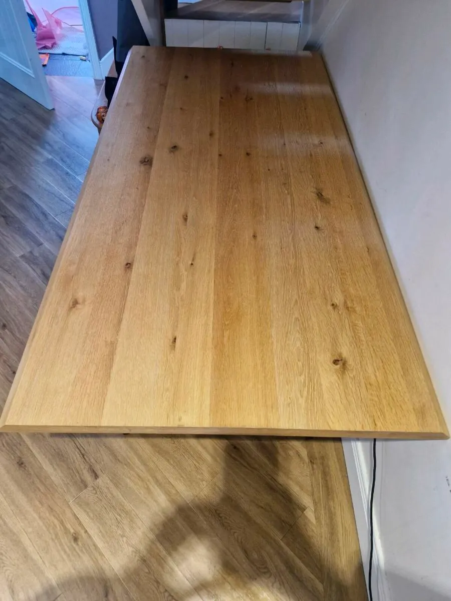 Solid oak dining table with black metal base - Image 2