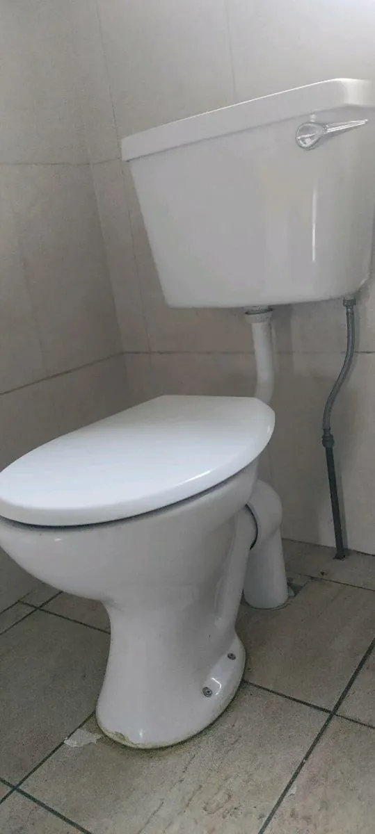 Hand sink and toilet - Image 1