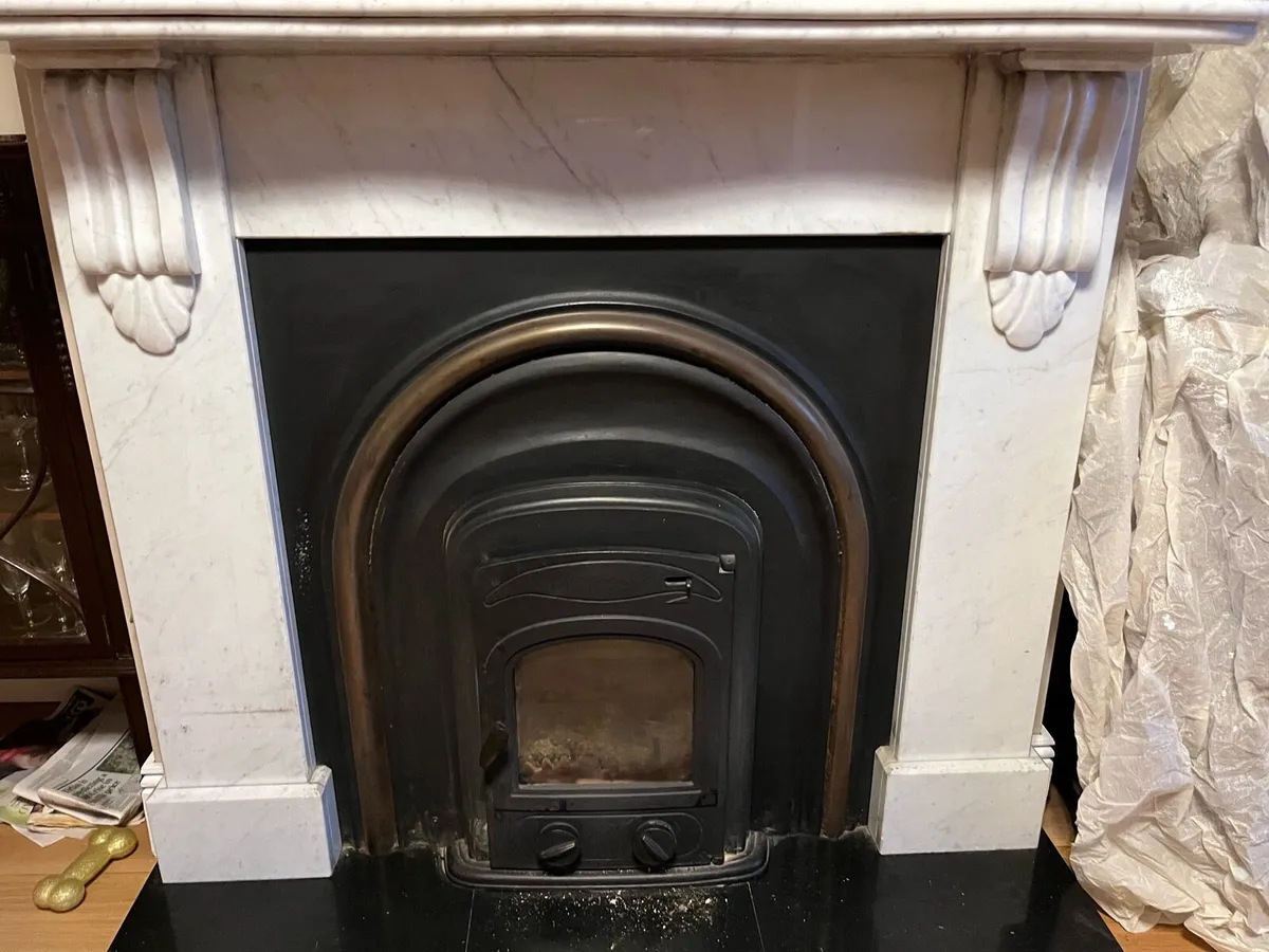 Cast iron insert stove with surround