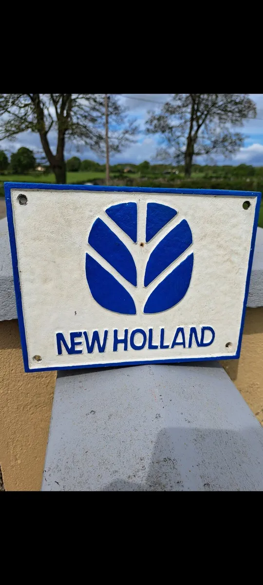 New Holland cast iron sign