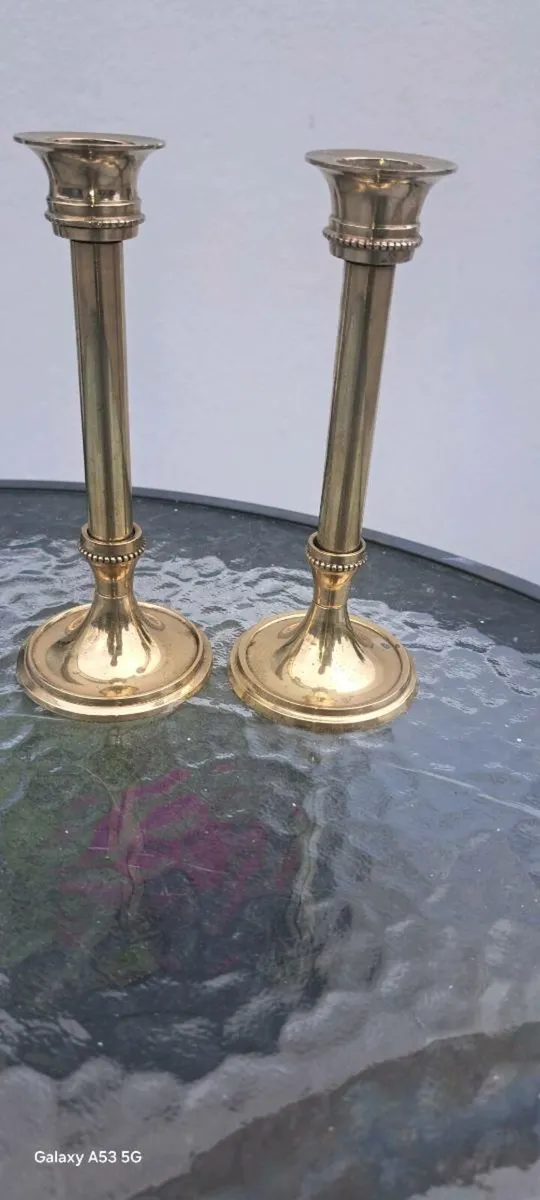 2 small brass candle stick holders