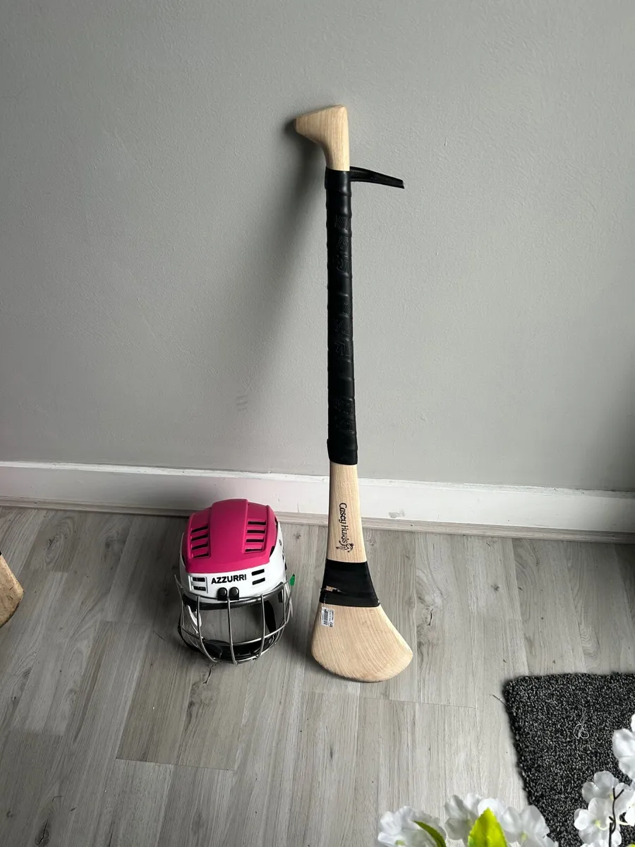 helmets with hurling sticks in perfec. - Image 2