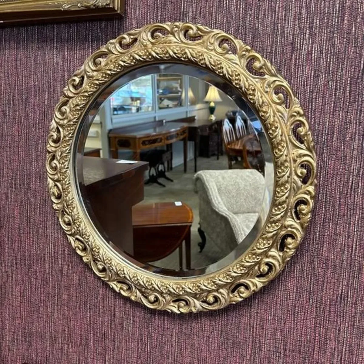 Beautiful ornate bevelled round wall mirror