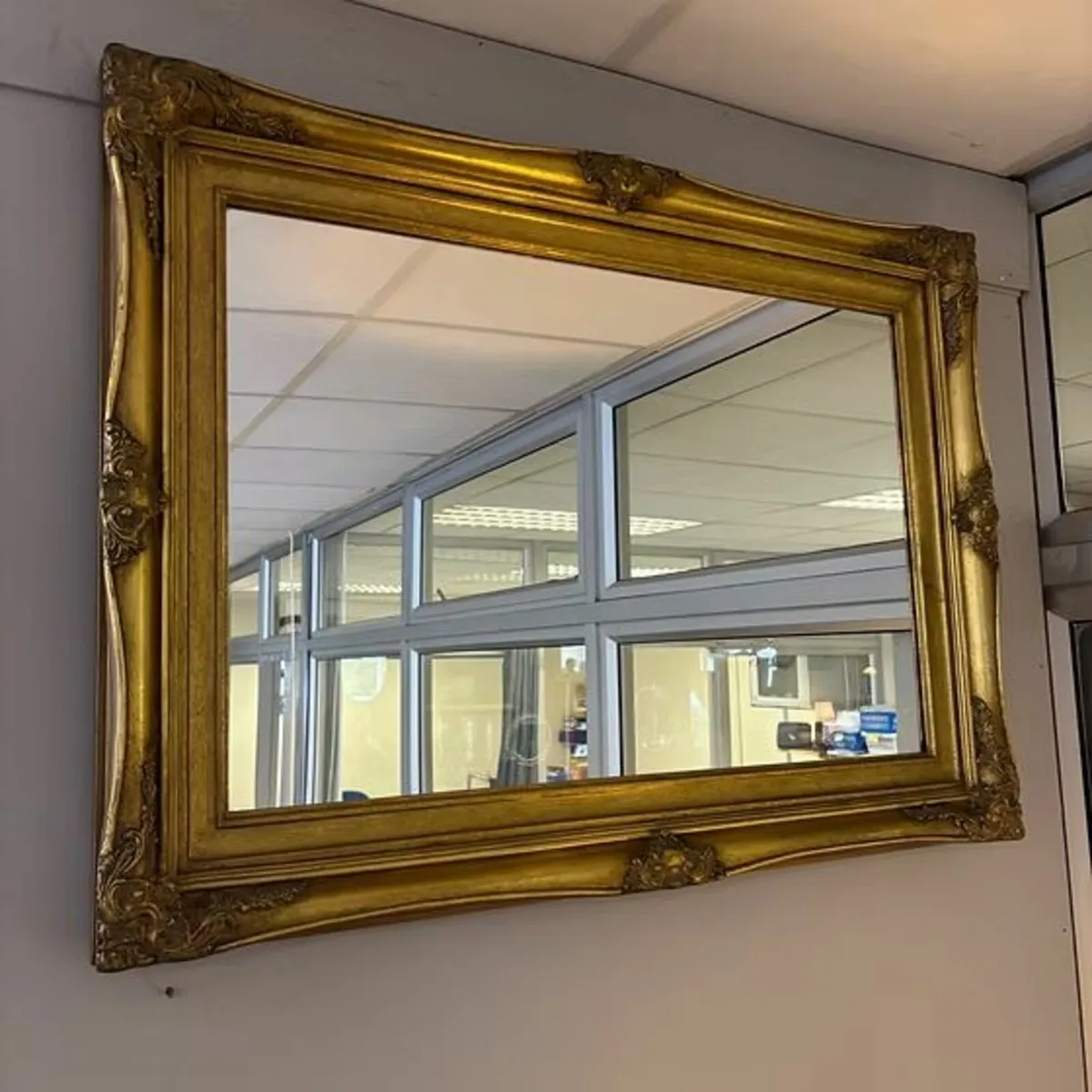 Beautiful ornate shaped wall mirror