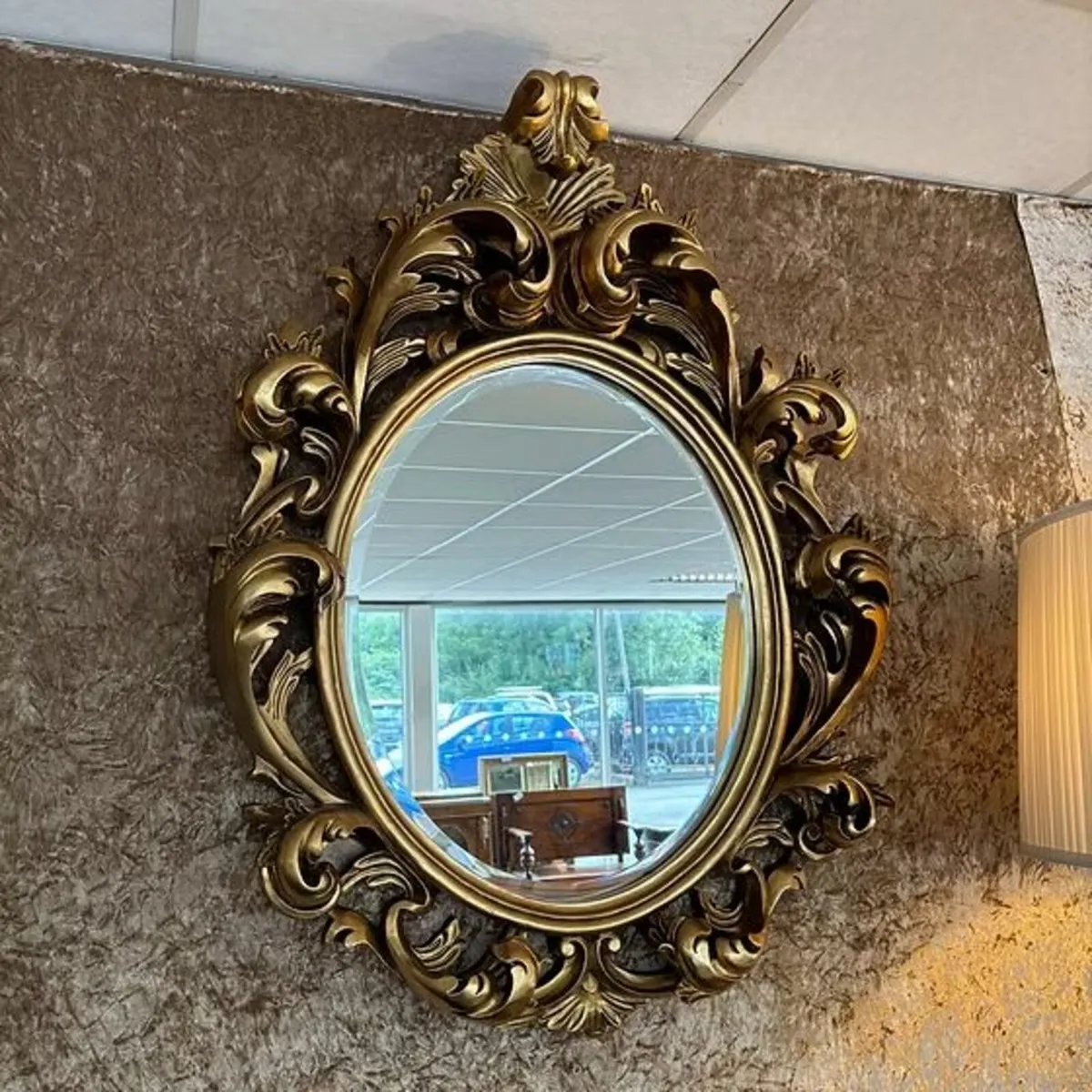 Fabulous gilt ornate oval shaped wall mirror
