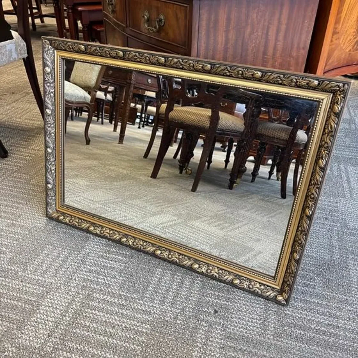 Stunning gilt ornate bevelled wall mirror