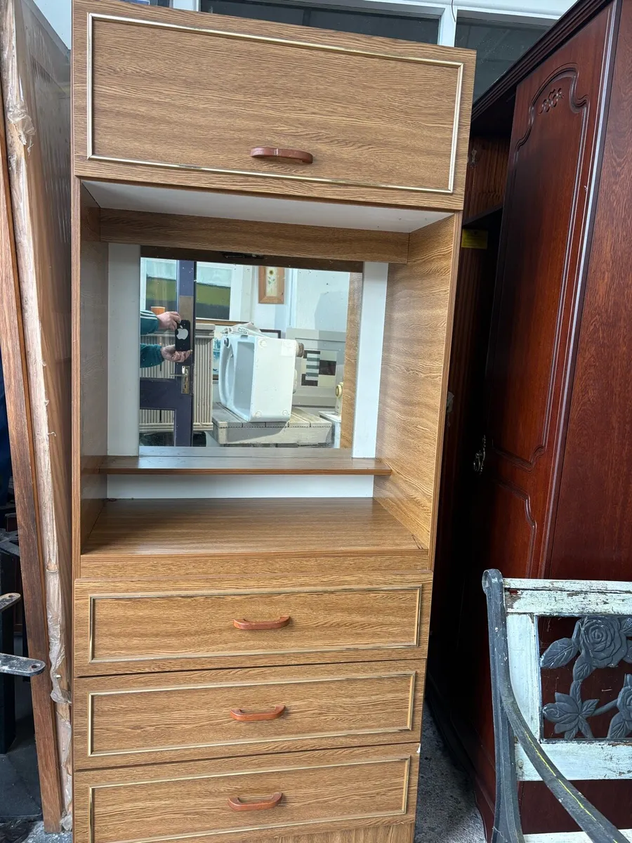 Tall bedroom storage unit with mirror