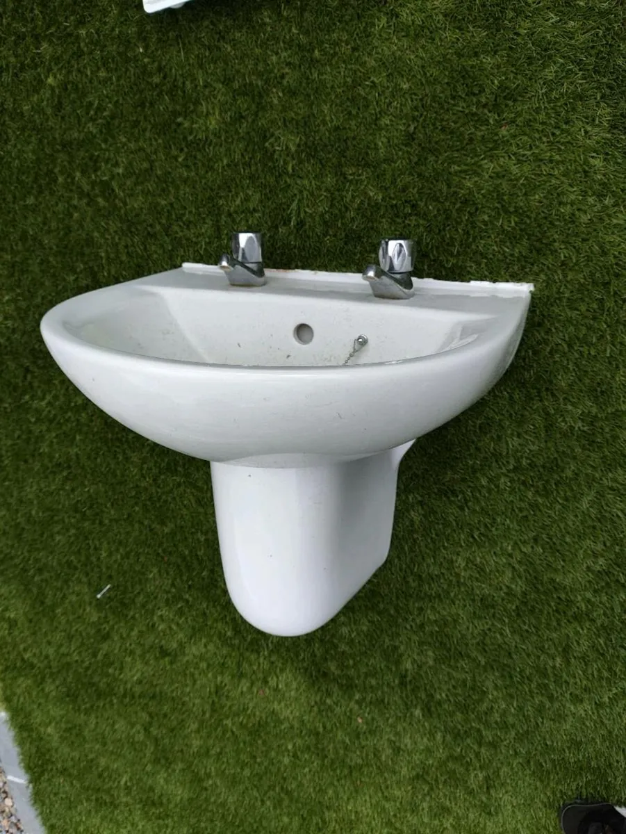 Bathroom sink with two faucet