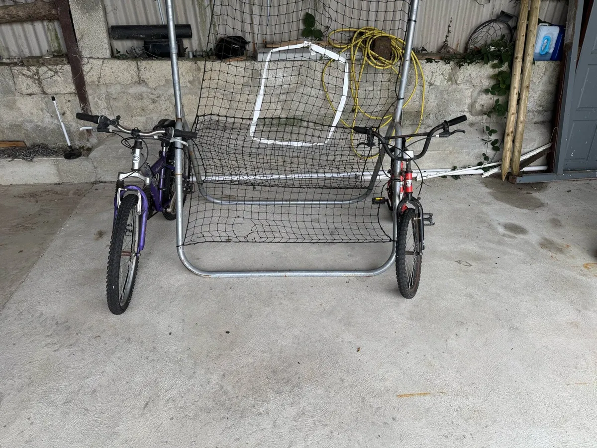Two kids bikes and rebounder net - Image 3